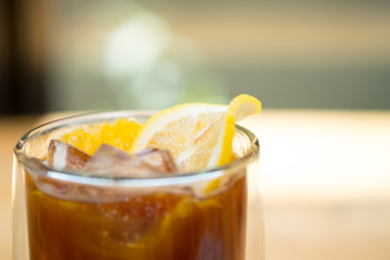 Glass of espresso shot mixed with orange juice