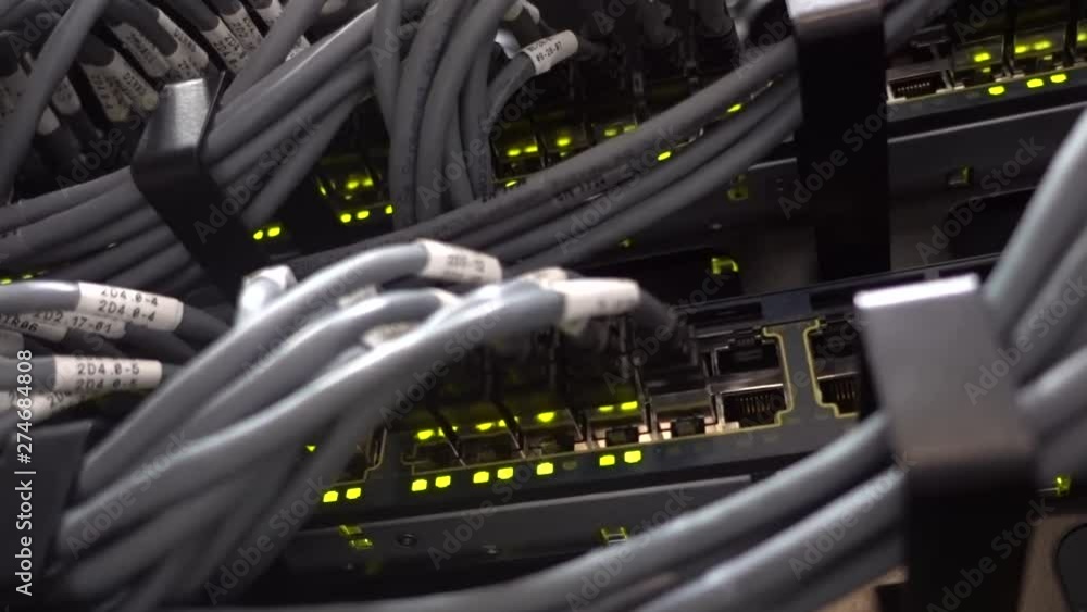 Aufkleber network switch hub and ethernet cables lan in datacenter. the video contains small vibrations.