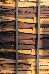 Pile of wood folding chairs