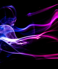 Colored smoke on black background