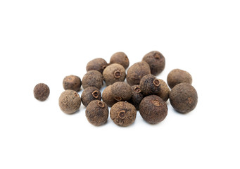 Scattered allspice isolated on white background