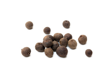 Scattered allspice isolated on white background
