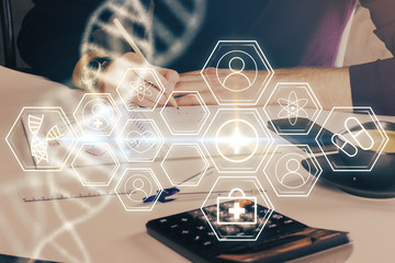 Man's hands working with notes background. Genetic engineering and gene manipulation concept.