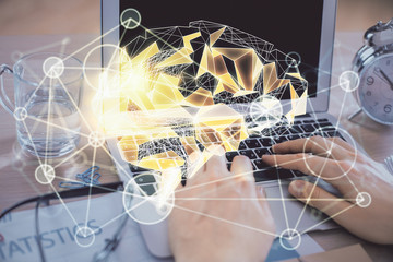 Man typing on keyboard background with brain hologram. Concept of big Data.
