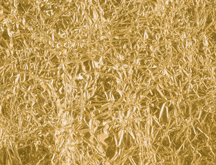 Gold wrinkled paper texture abstract background