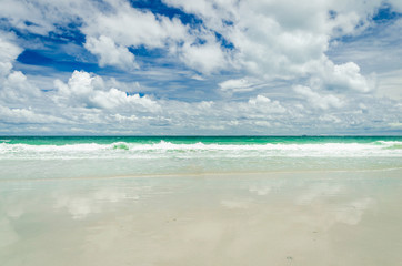 Fototapeta premium beautiful clear blue sea water on the beach paradise ocean with sky and cloud. vacation background on summer in Thailand coast.