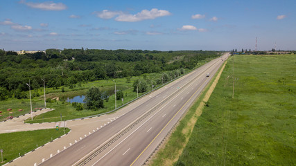 Fototapeta na wymiar Aerial Shot Of A Highway Passing Through The Rural Countryside