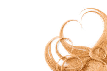 Blond hair isolated on white background. Heart shape