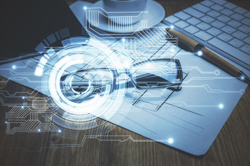 Data tech hologram with glasses on the table background. Concept of technology. Double exposure.
