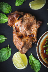 Top view grilled beef steak on a black background with herbs and spices, Piece of cooked rump steak with served.