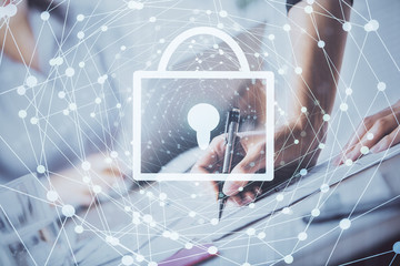 Double exposure of hands making notes with lock icons. Concept security and protection of data