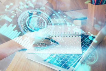 International business hud over woman's hands writing background. Concept of hard work. Double...