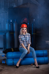 girl in a blue shirt red helmet