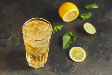 lemonade with lemon and ice (cooling drink). top food background. copy space