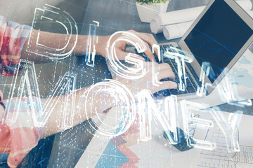 Crypto currency theme hologram with businessman working on computer on background. Concept of...