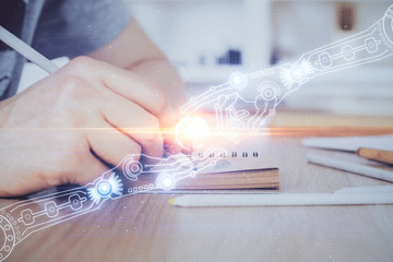 Writing human hands with tech theme multi exposure icons.