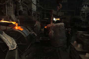 Work in the foundry. molten metal worker at a metallurgical plant