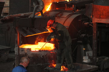 Work in the foundry. molten metal worker at a metallurgical plant