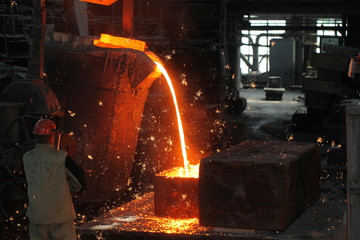 Work in the foundry. molten metal worker at a metallurgical plant