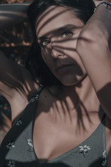 Portrait of woman between shadows