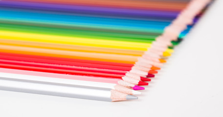 colored pencils lying in row