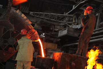 Work in the foundry. molten metal worker at a metallurgical plant