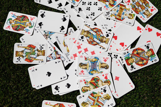 Playing poker cards on a green background
