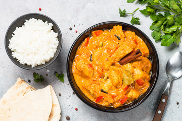 Chicken tikka masala with rice top view.