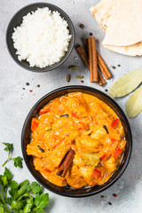 Chicken tikka masala with rice top view.