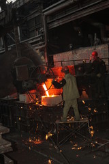 Work in the foundry. molten metal worker at a metallurgical plant