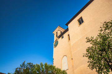 The Convent of S. Maria delle Grazie, in Santa Maria square. The bell tower with the clock. The blue sky at sunset. Zagarolo, Province of Rome, Lazio, Italy