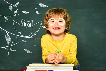 Back to school and happy time. Schoolkid or preschooler learn. Concept of education and reading. Kids school.