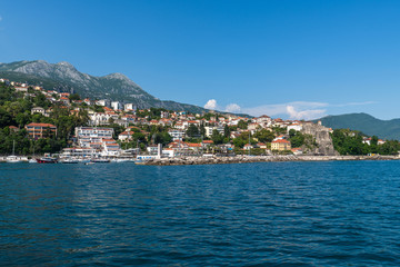 Fototapeta na wymiar Herceg Novi, Montenegro - June 10. 2019. Panorama of the city from the sea
