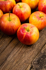 apple fruits in a row, old weathered wood table background