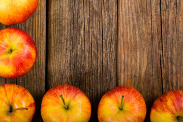 apple fruits frame background, old weathered wood table