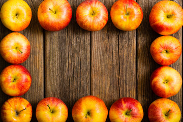 apple fruits frame background, old weathered wood table