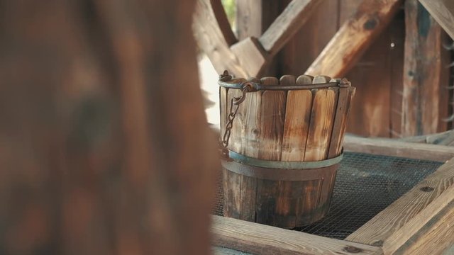 And old wooden water whell with wood bucket, retro vintage traditional village concept. Shot in FullHD