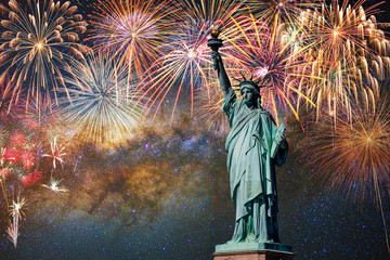 Statue of Liberty over the Multicolor Fireworks Celebrate with the milky way background, 4th of July and Independence day concept © THANANIT