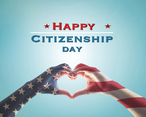 Happy citizenship day with American flag pattern on people hands in heart  shape