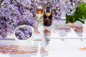 bottles of creams and oils. Spa and aromatherapy. bouquets of flowers.