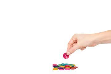 Hand with colorful sewing buttons, decoration accessory.