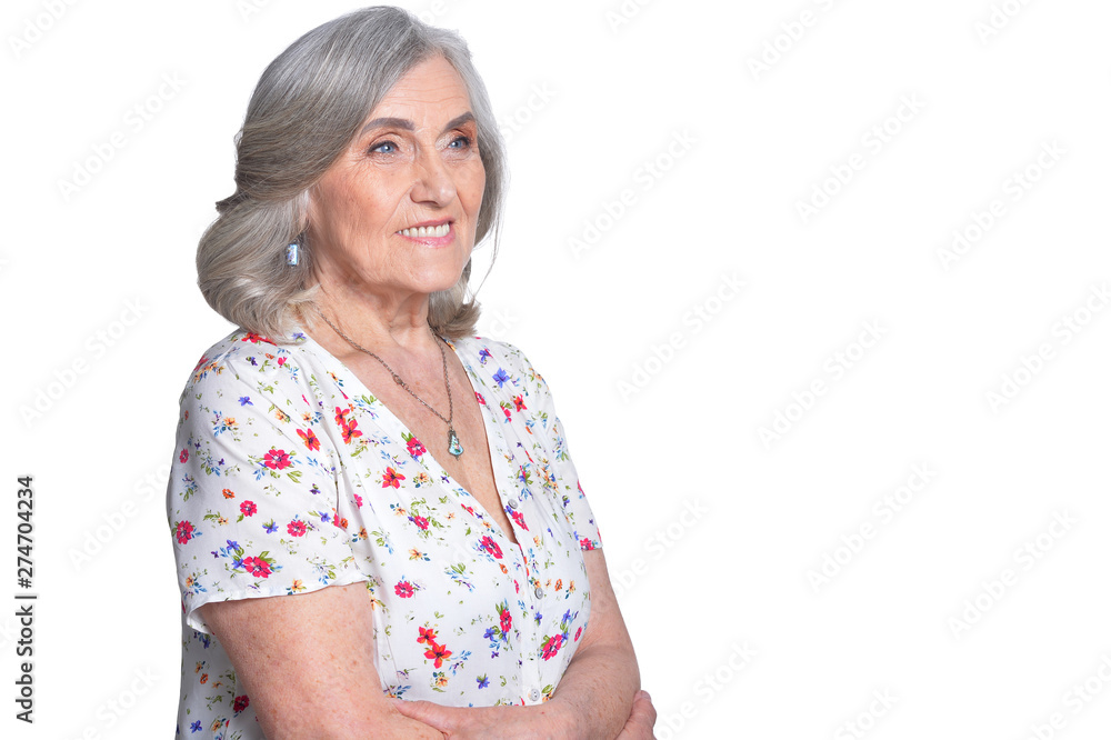 Wall mural Portrait of happy senior woman on white background