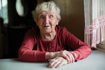 Closeup portrait of happy elderly woman.