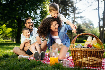 Family picnic outdoors togetherness relaxation happiness concept