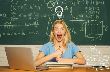 Portrait of a beautiful woman student. Happy mood smiling broadly in university. Female university student on campus. Portrait of on college student on campus.