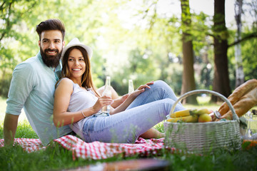 Couple in love enjoying picnic time outdoors