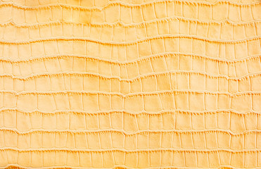 Yellow stylized crocodile skin background