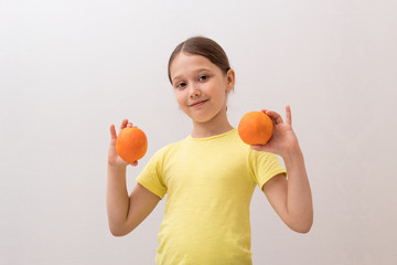 little girl with juicy oranges, baby playing with fruit