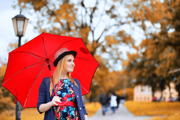 Girl in the street with an umbrella