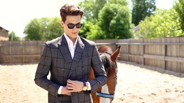 Handsme men standing in a ranch